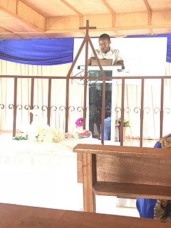 Scripture reading Bro. Prince Cooper
